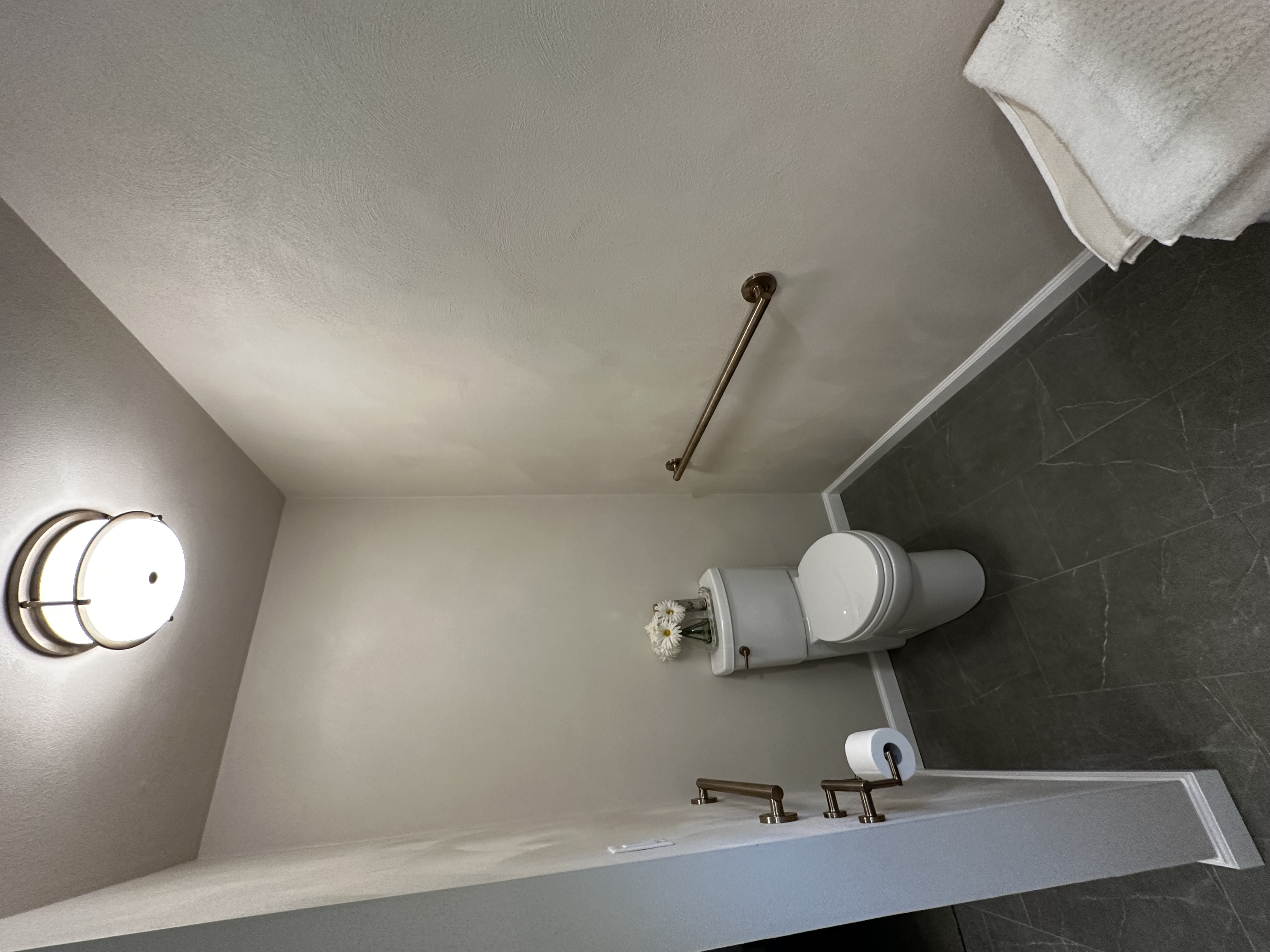 Completed separate toilet area with new flooring, trim, paint, and fixtures